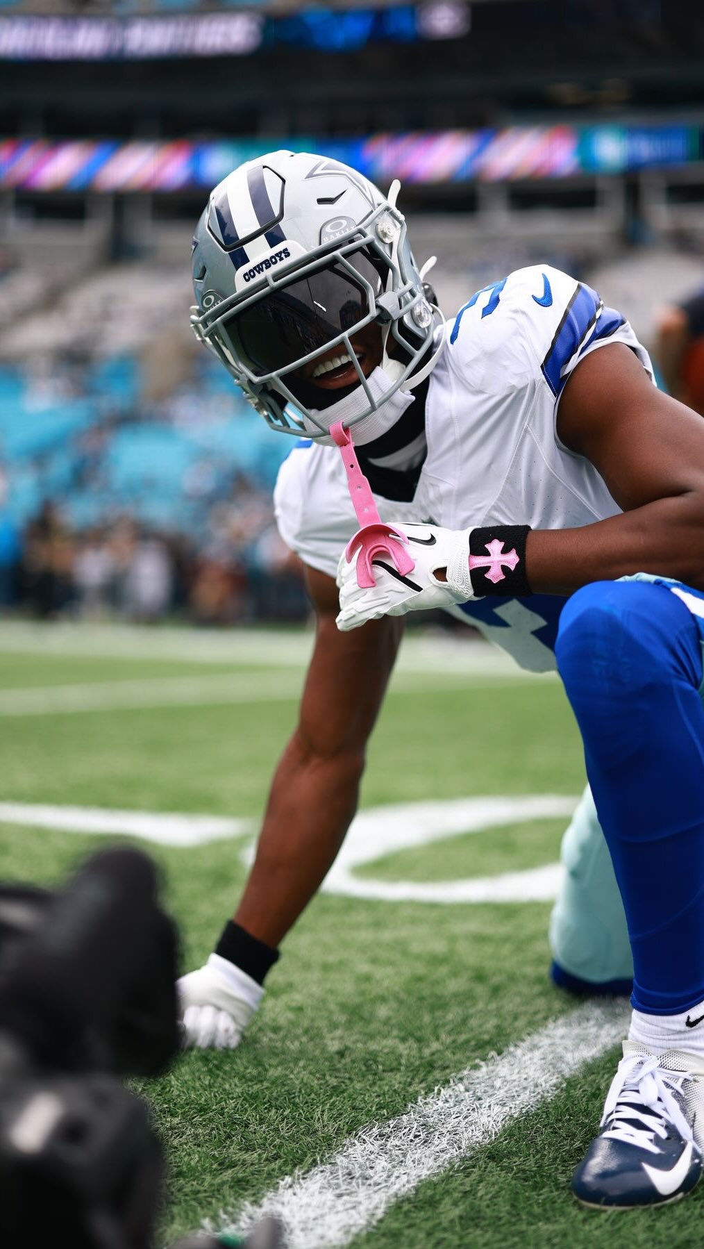 Cowboys player on the field, captio...