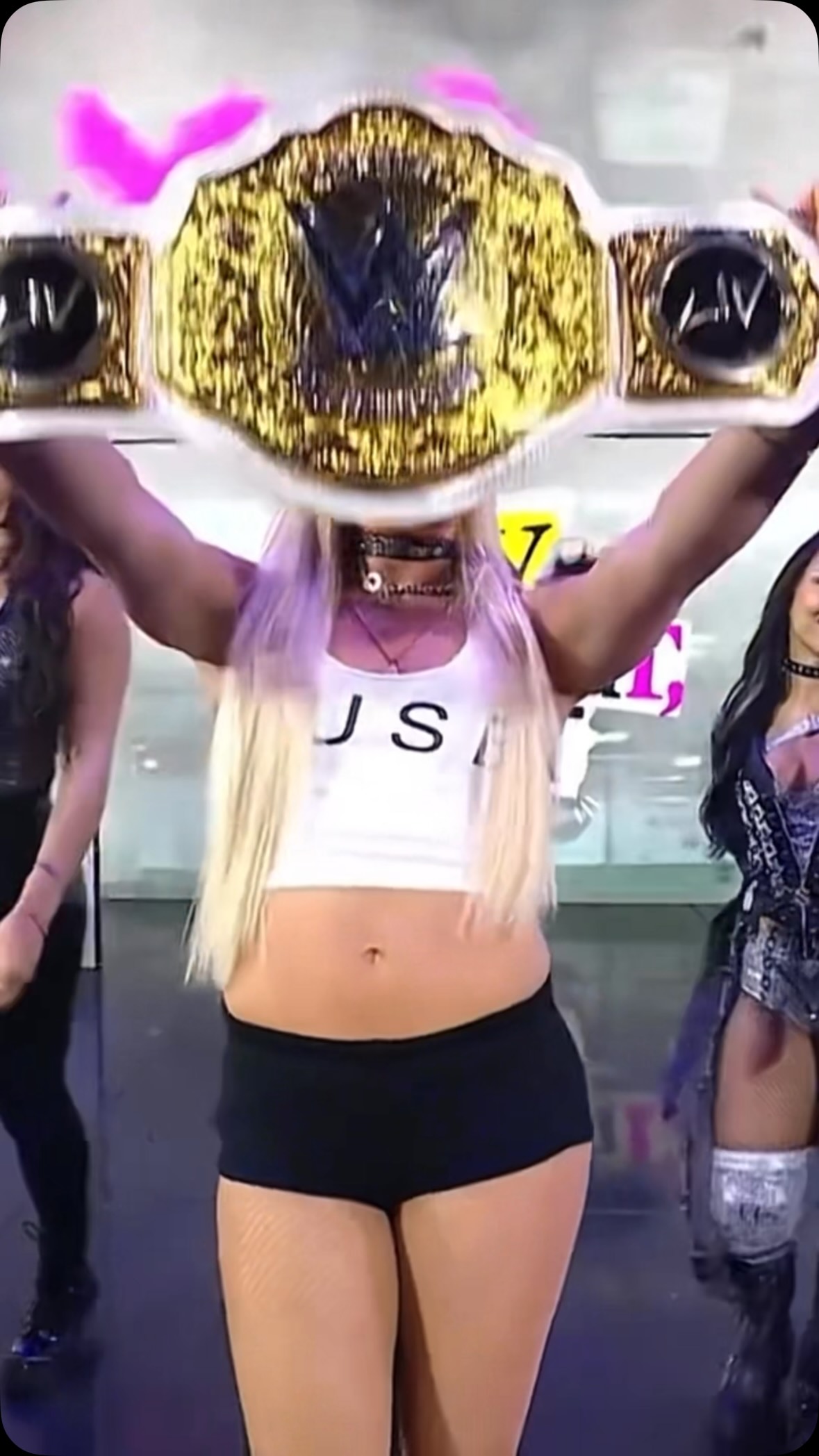 Liv Morgan celebrates with her cham...