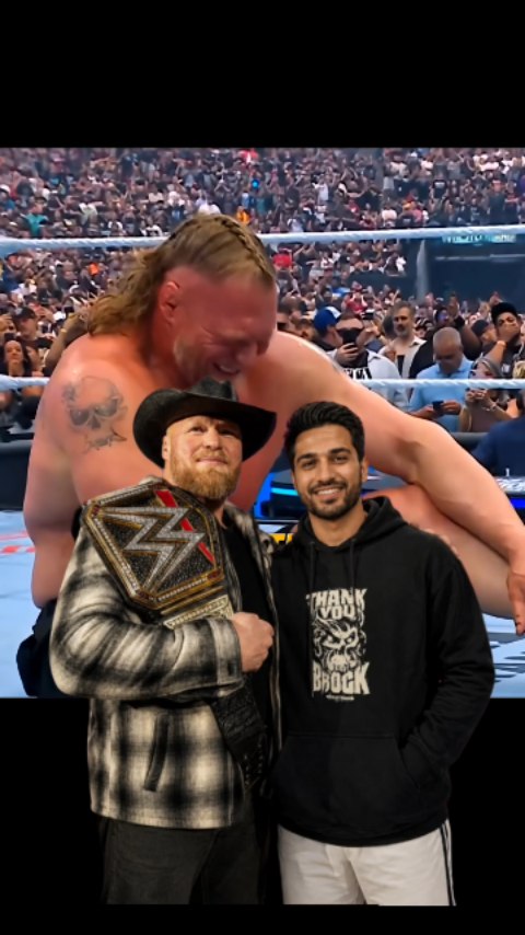 A fan poses with Brock Lesnar in fr...