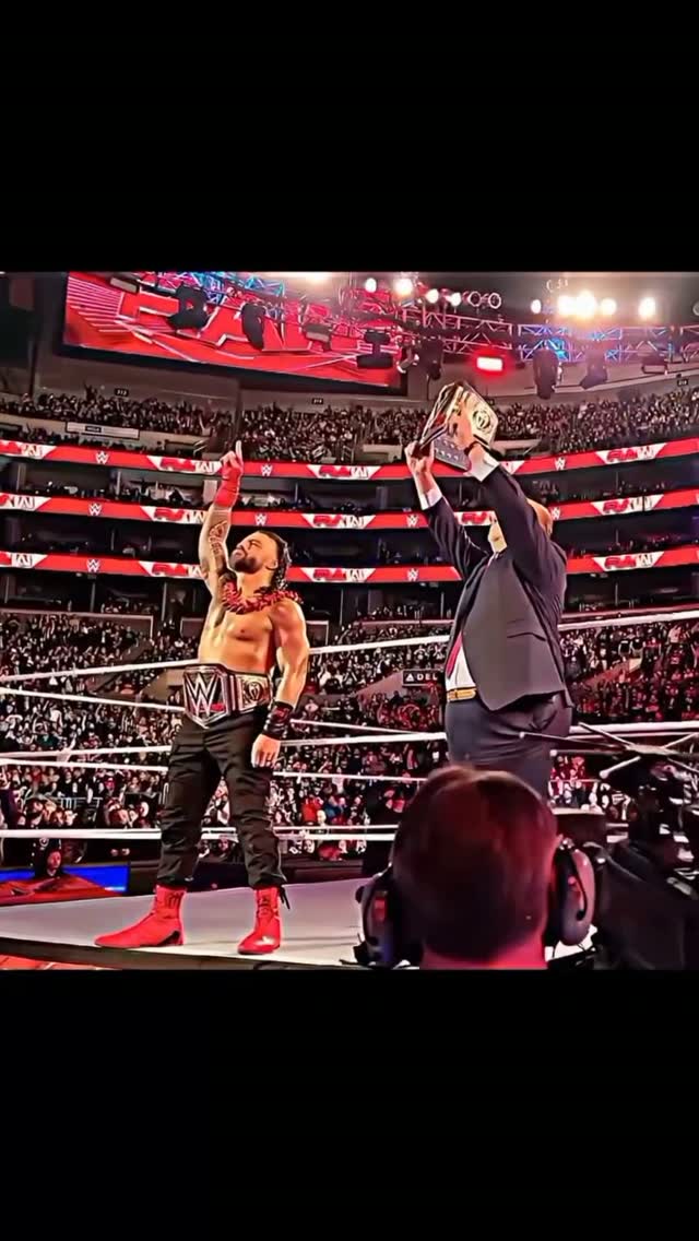 Roman Reigns and Paul Heyman in the...