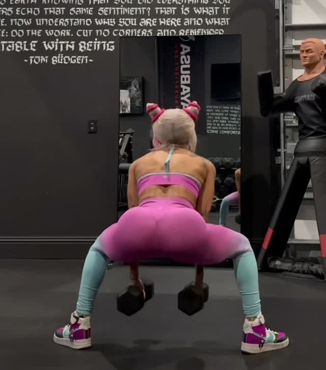 Zelina Vega trains with dumbbells