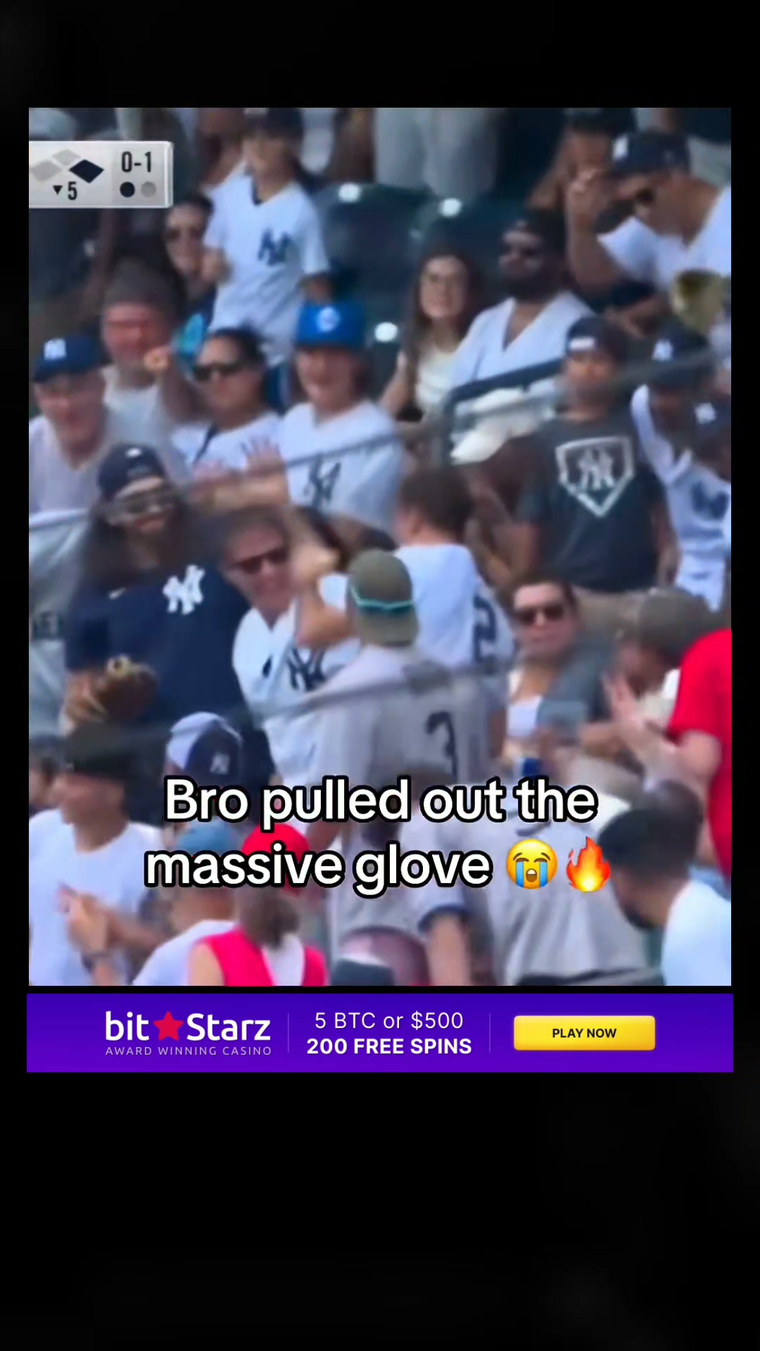 A fan pulls out a "massive glove" a...