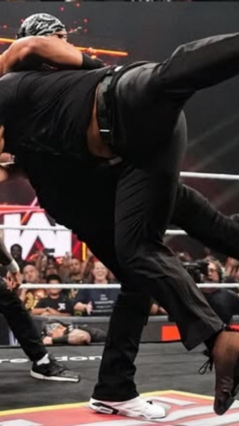 Wrestler performing a move in the r...