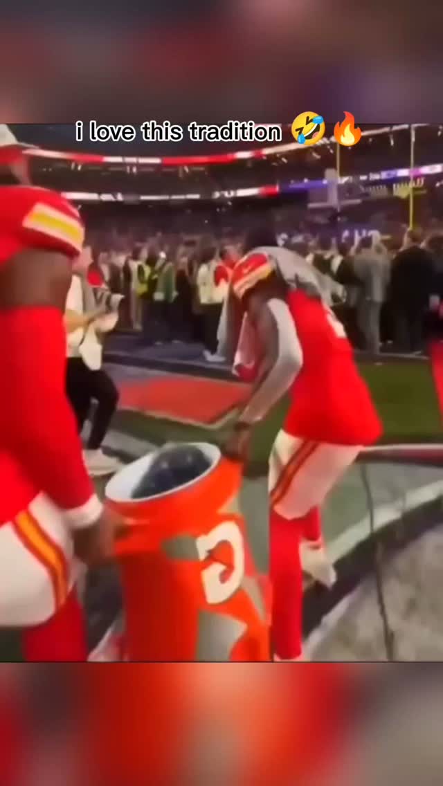 Football player dumping a cooler ov...