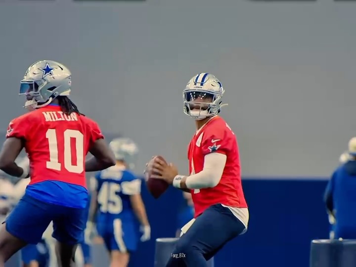 Dak Prescott and a teammate in prac...