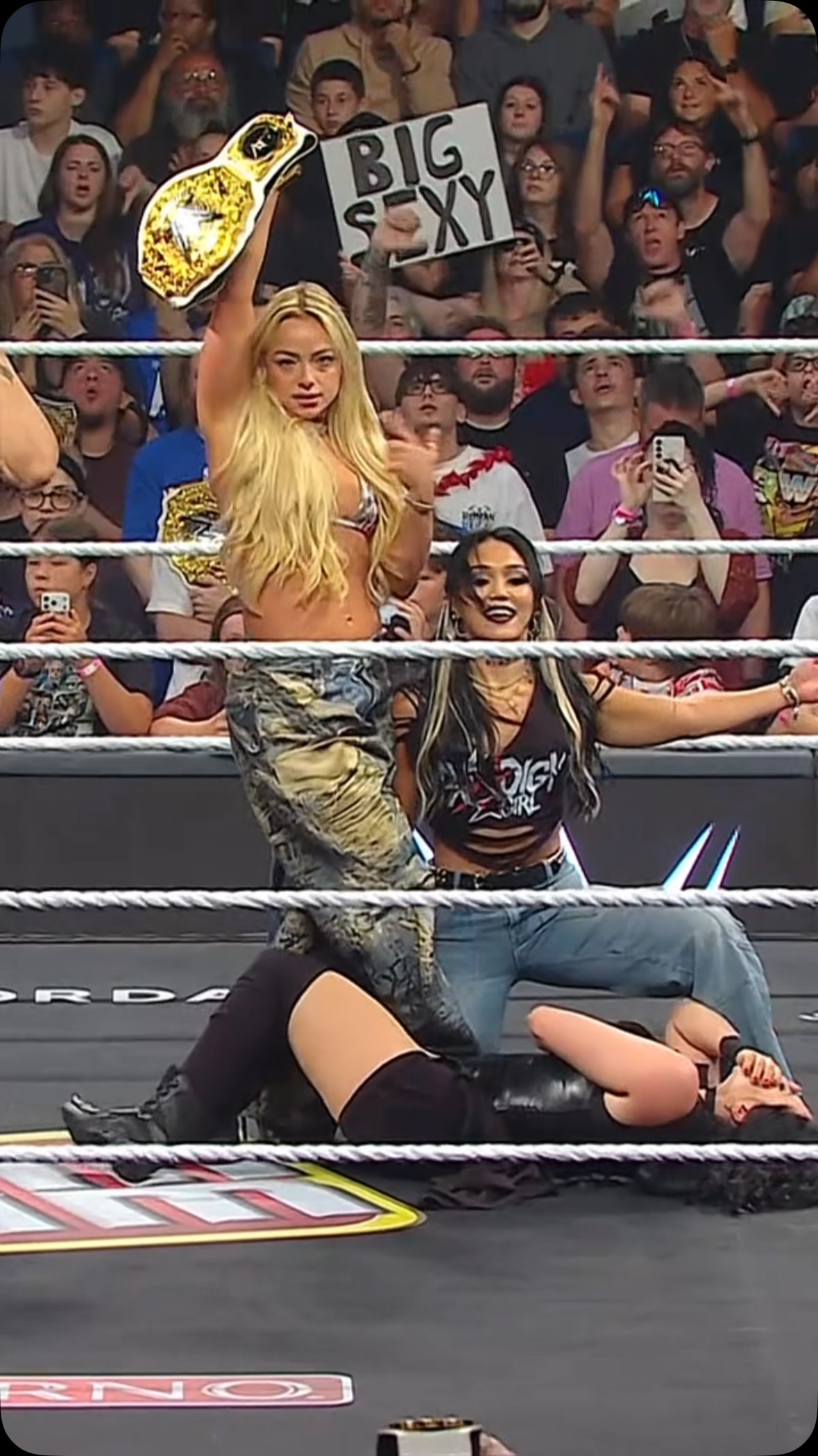 Liv Morgan celebrates with her cham...