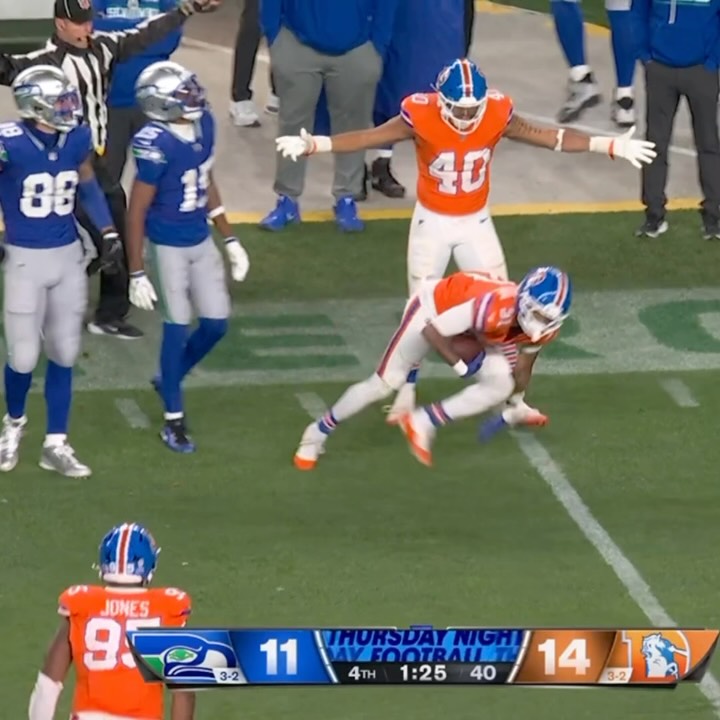 Broncos player intercepts the ball ...