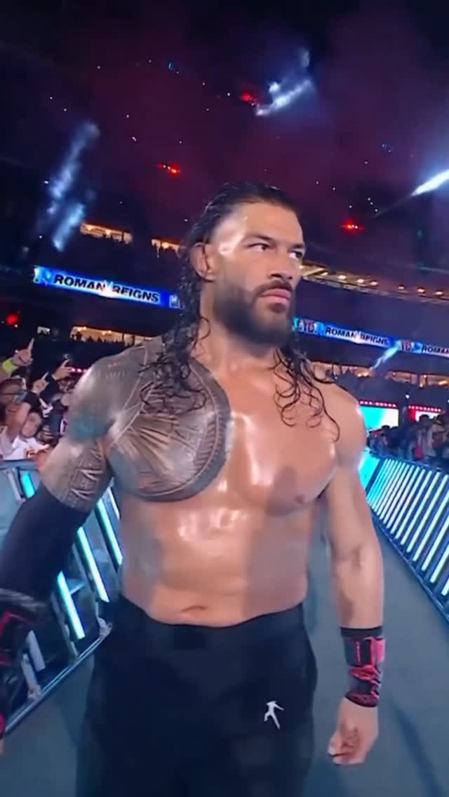 Roman Reigns' entrance into the rin...