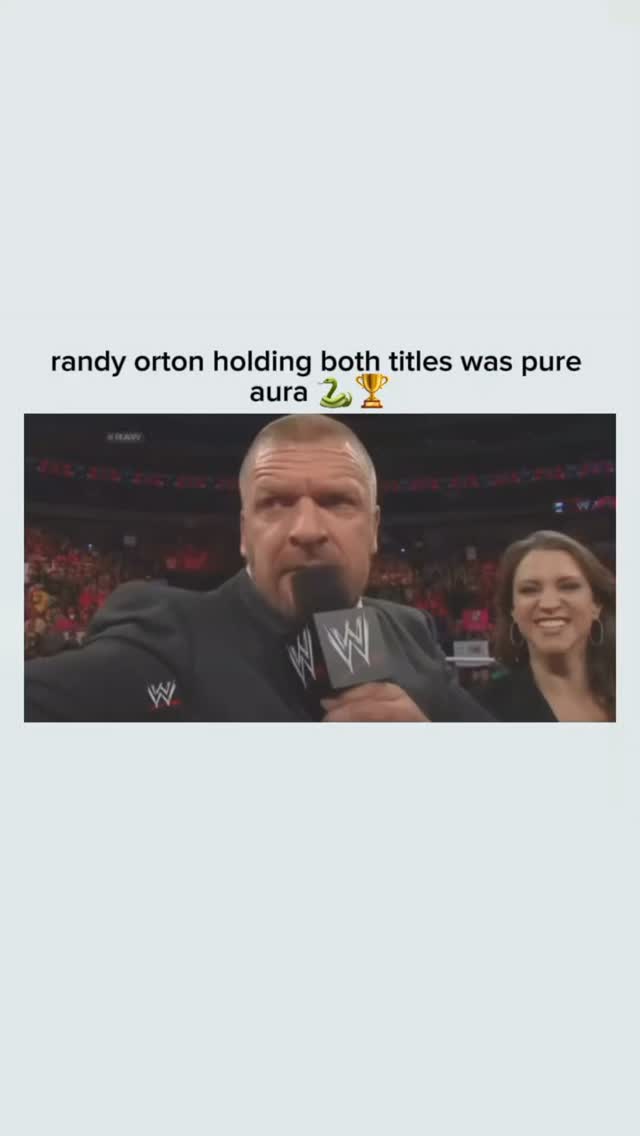 Randy Orton holding both championsh...