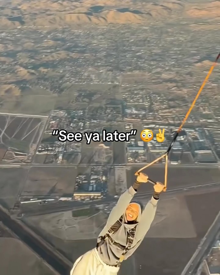 Skydiver waves goodbye to the plane...