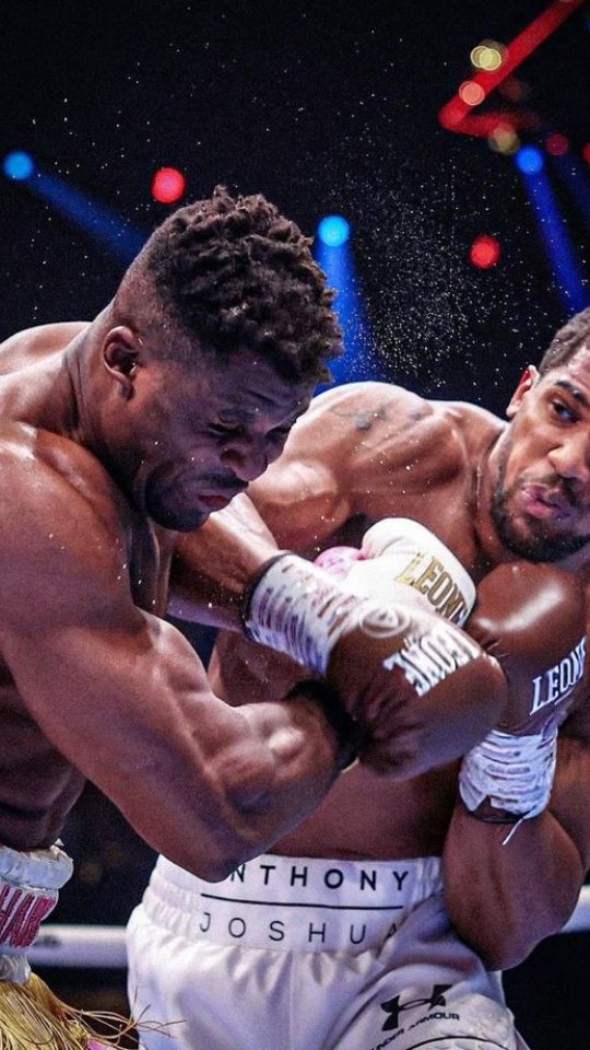 Anthony Joshua in action during a f... on MILLIONS Anthony Joshua in action during a f...