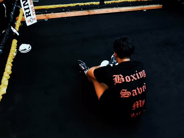 A man in a "Boxing Saved My Life" t...
