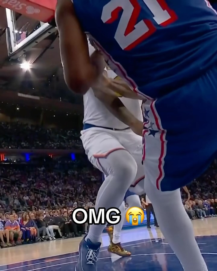 Joel Embiid crushes a camera during...