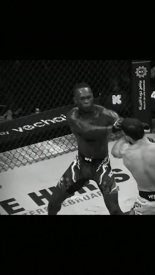 Israel Adesanya throws a punch in t...
