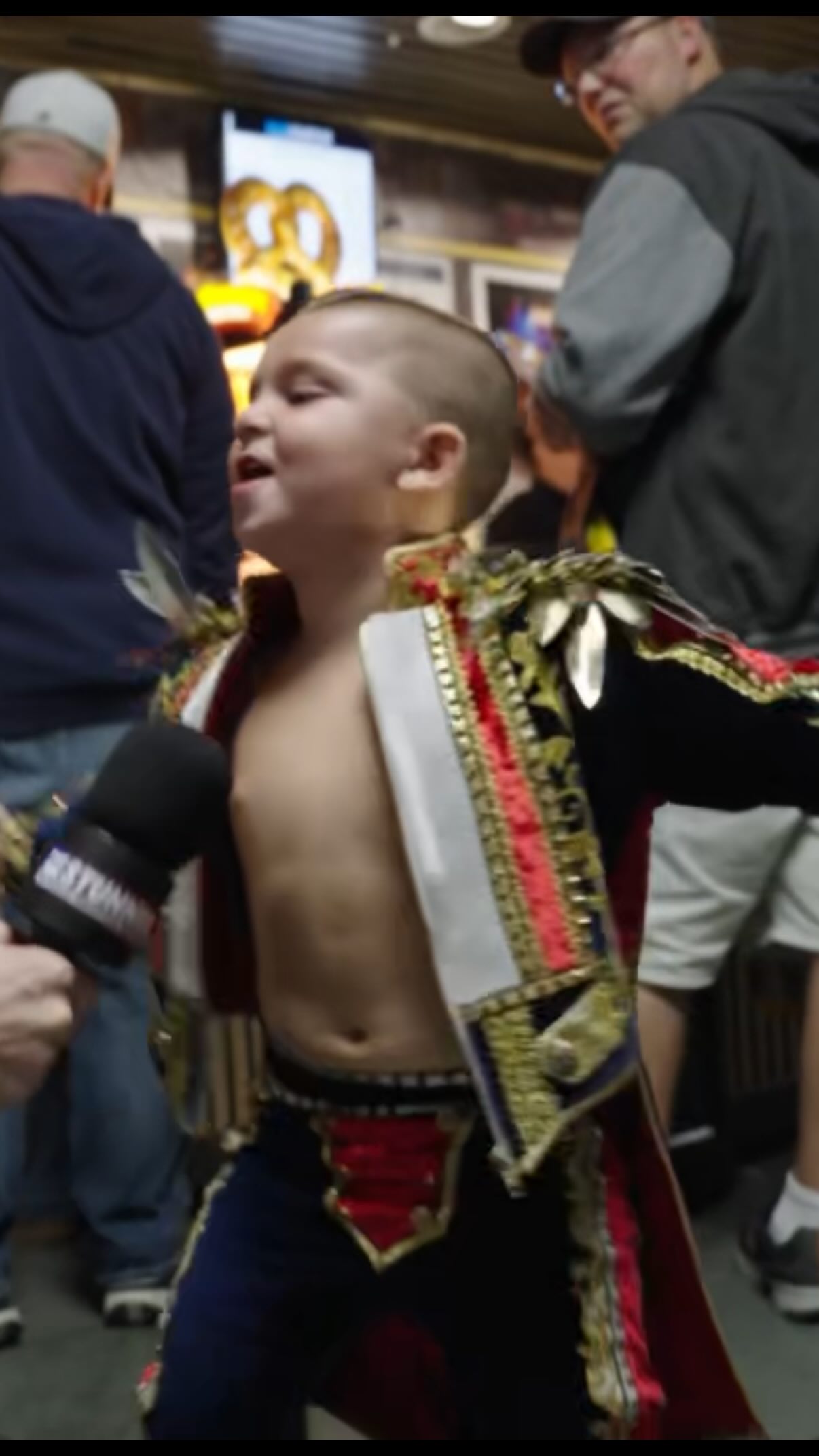 Young Cody Rhodes fan dressed as "A...