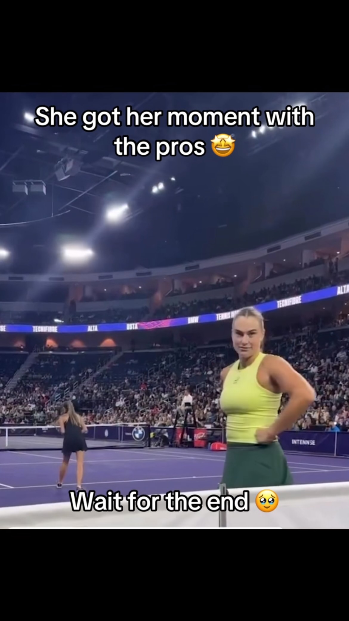Aryna Sabalenka lets a ball girl pl...