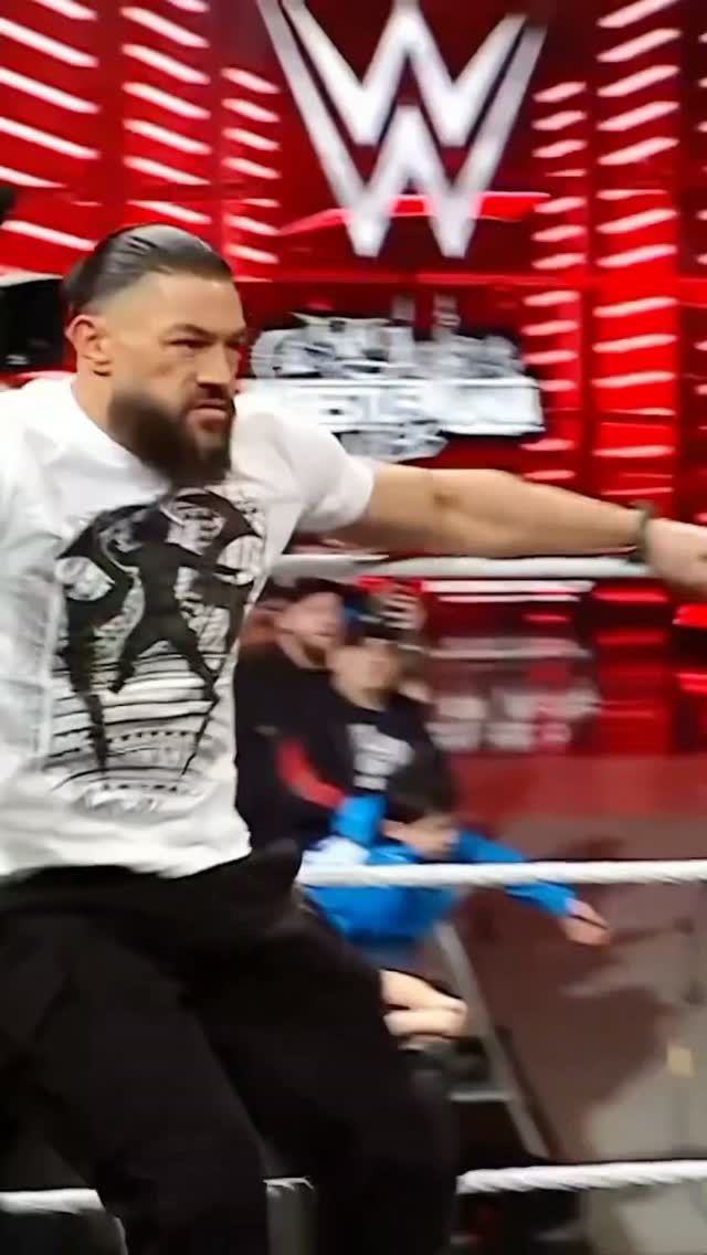 Roman Reigns enters the ring in a m...