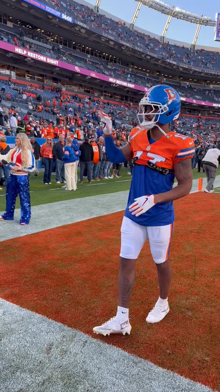 Broncos WR Jaylen Waddle tosses the...