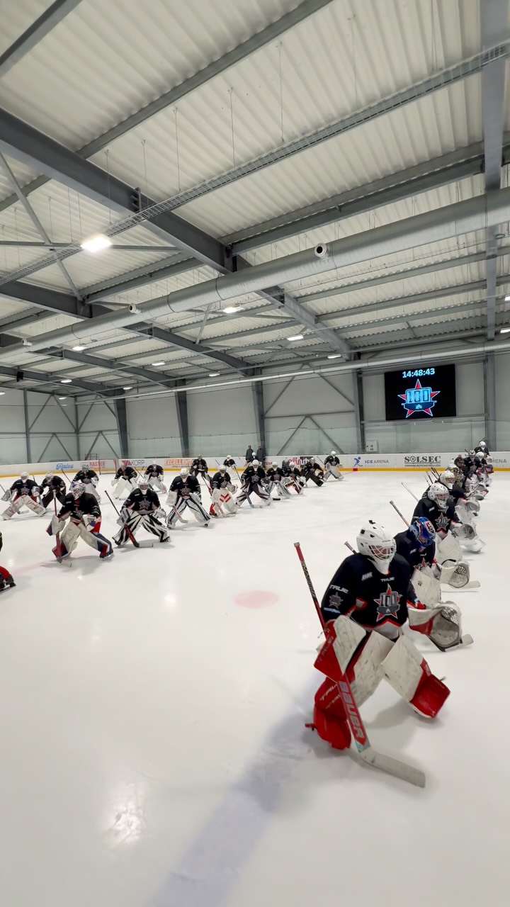 Goalies training in sync on the ice