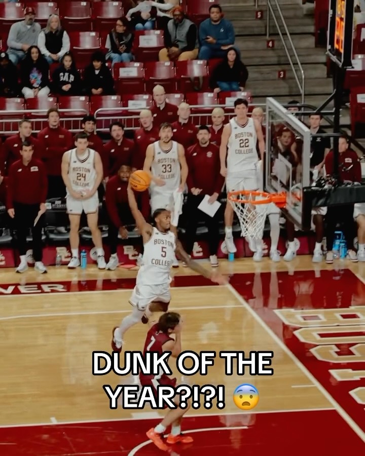 Basketball player jumps over an opp...