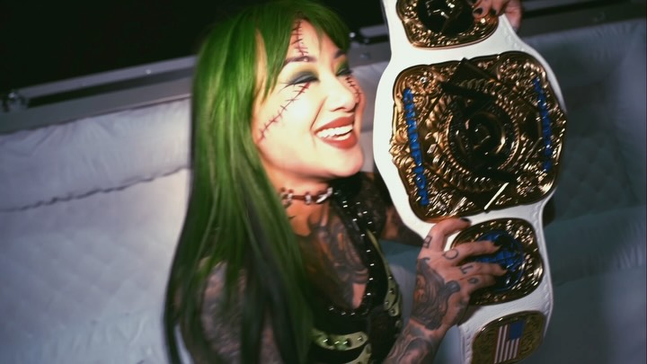 Wrestler in Frankenstein makeup pos...