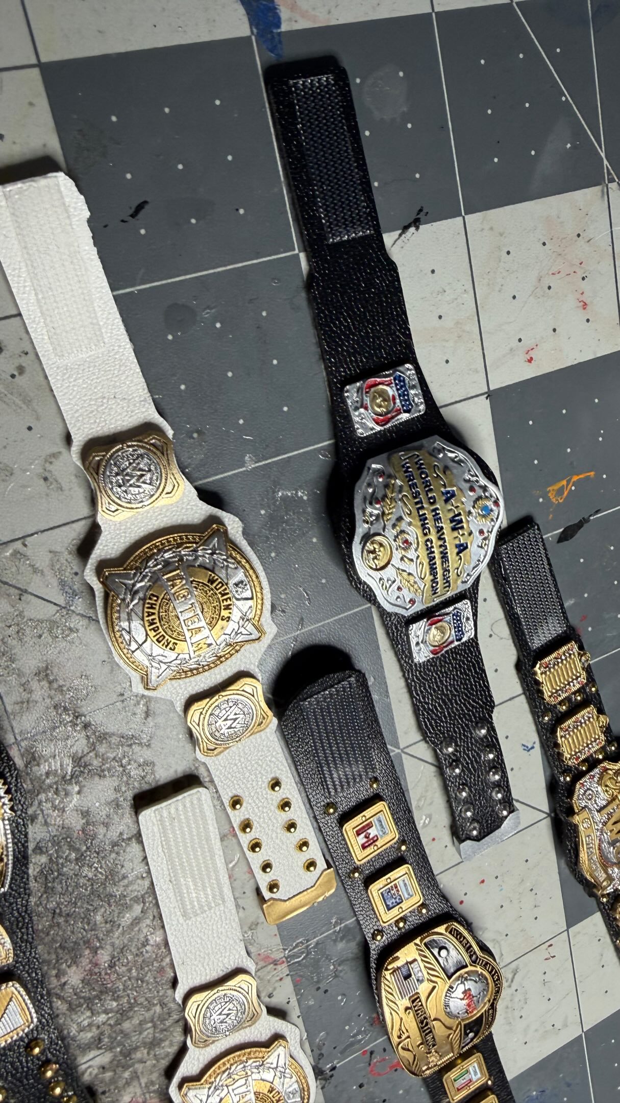 Miniature championship belts by Tur...