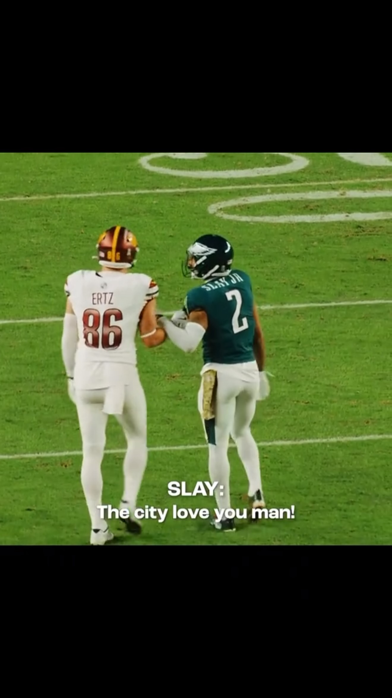 Eagles and Commanders players shake...