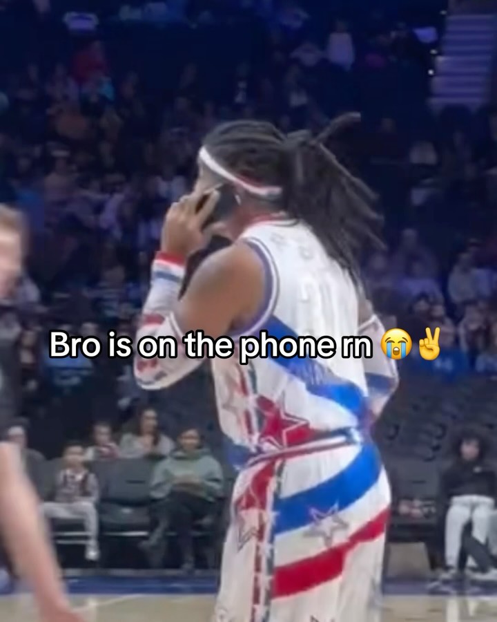 Harlem Globetrotter on the phone du...