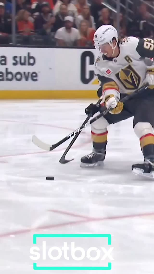 Hockey player handling the puck on ...