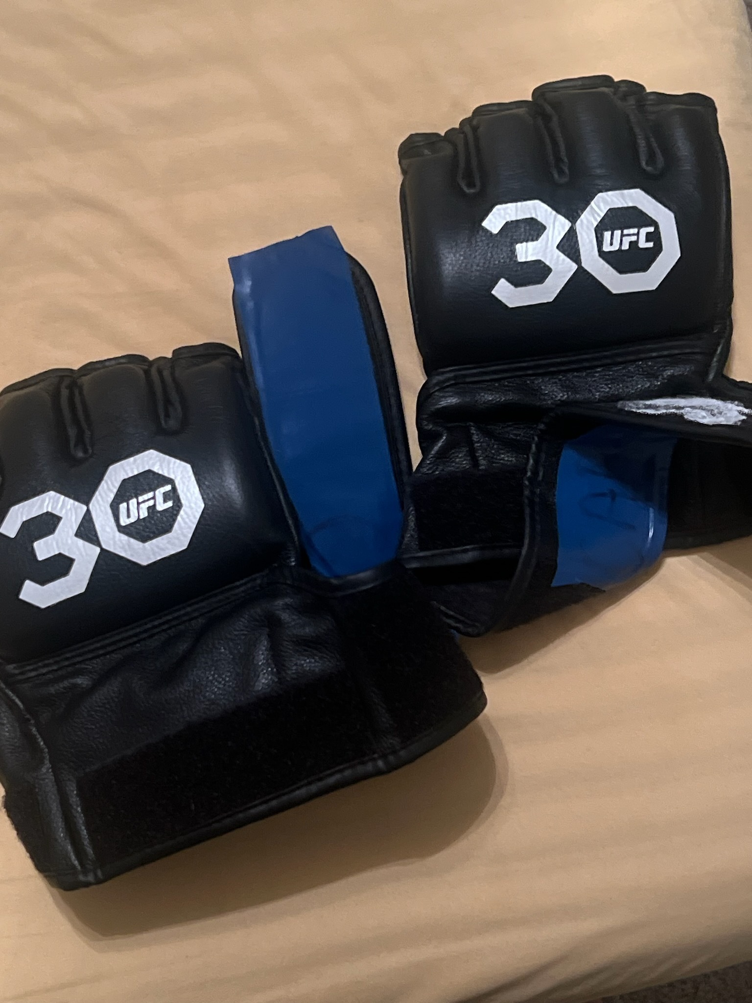 Terrance McKinney Autographed Fight-Worn 30th Anniversary UFC Gloves on MILLIONS Terrance McKinney Autographed Fight-Worn 30th Anniversary UFC Gloves